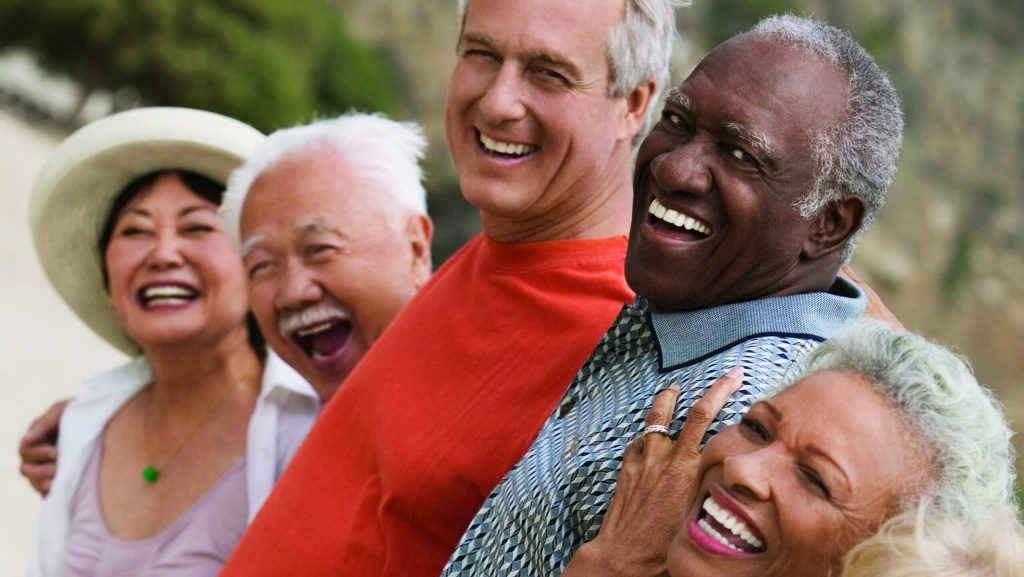 A group of old people laughing together