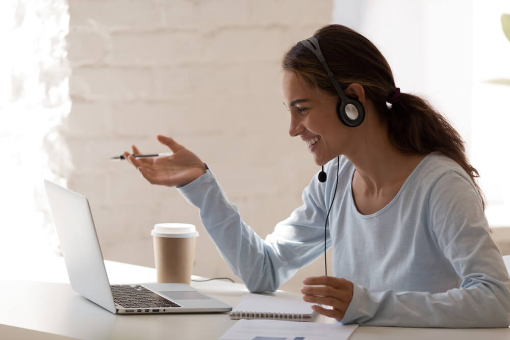 A women having a translation call on laptop